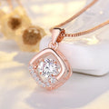 Copper heart-shaped pendant necklace with crown and bow details in rose gold or silver colour