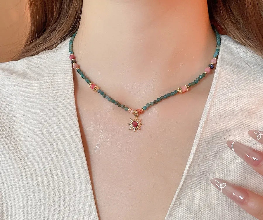 Freshwater pearl necklace with geometric sun stone pendant on adjustable clavicle chain
