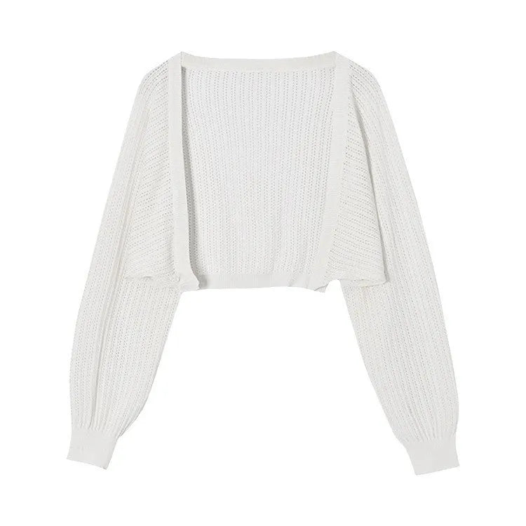 Women's lantern sleeve blouse in apricot colour with hollow thin fabric and long sleeves.