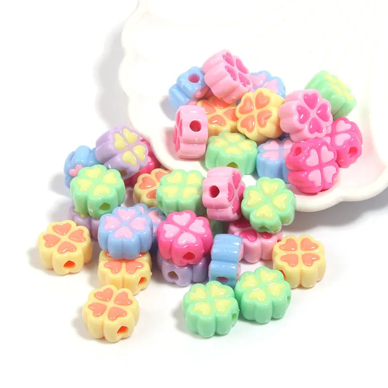 Acrylic four-leaf clover love beads with frosted finish in assorted light colours, 15mm size