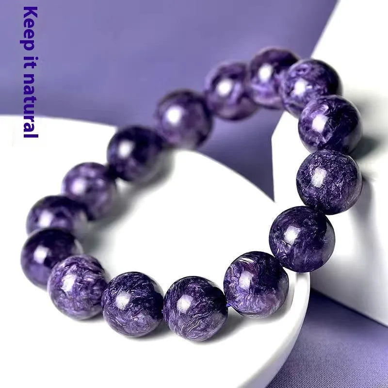 Transparent charoite crystal bracelet with platinum silver-plated components showing bead sizing options