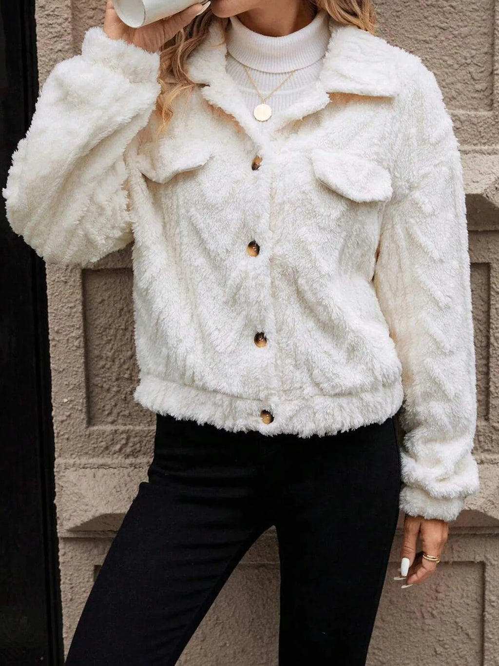 Women's ivory white double-sided plush button cardigan on a hanger
