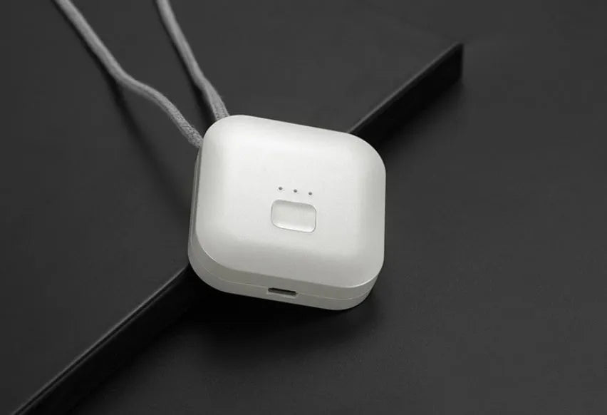 Mini USB air purifier necklace in pink, showing compact dimensions and wearable design.