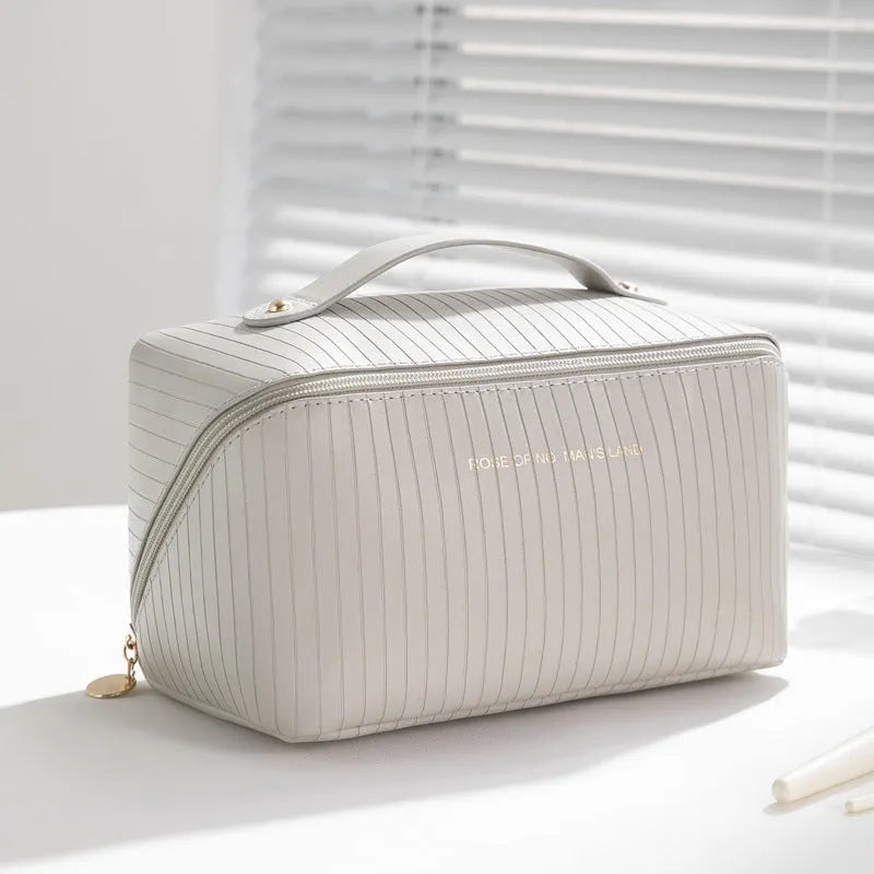 Cubic vertical pattern PU makeup bag in beige available in multiple colours for travel storage