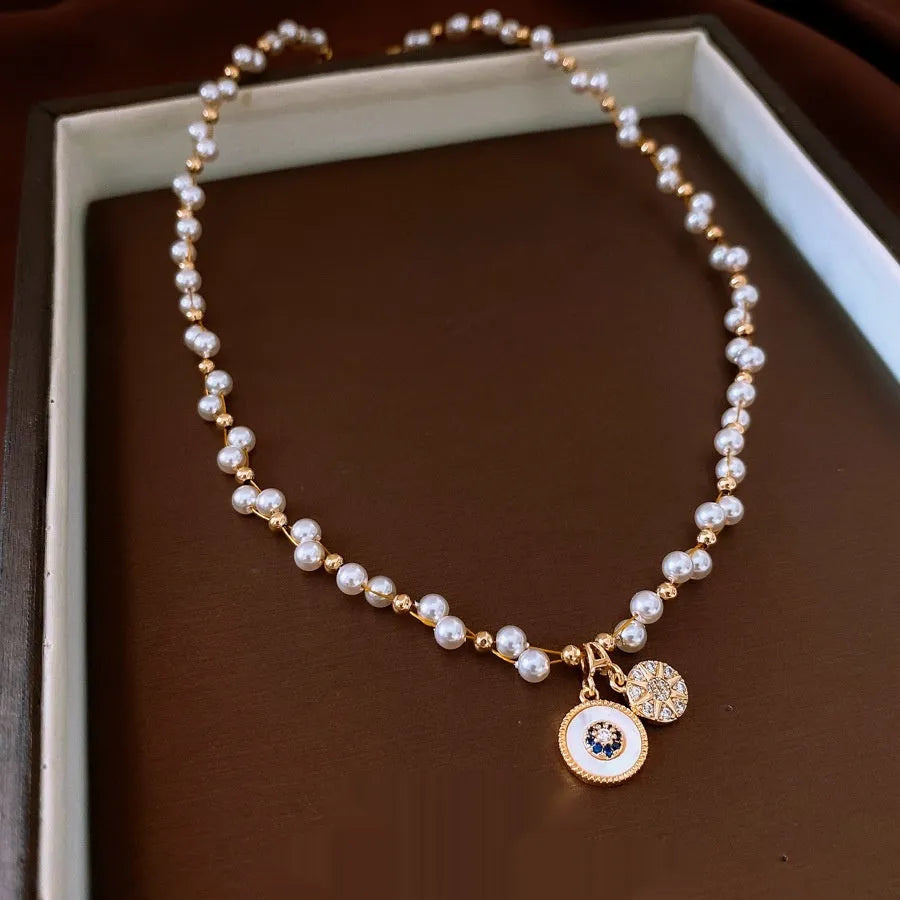 Gold plated clavicle chain necklace with round zircon and imitation pearl pendant