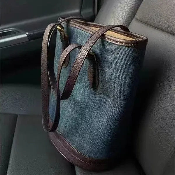 Retro denim patchwork one-shoulder bucket handbag showing large capacity interior
