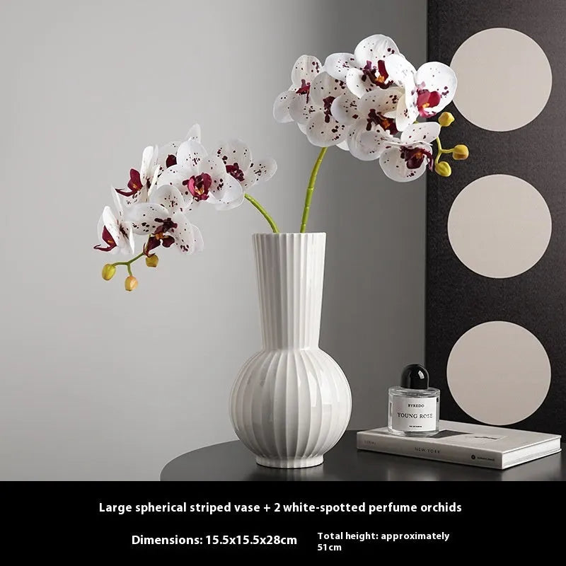 White ceramic ball striped vase in American country style on table with orchid arrangement