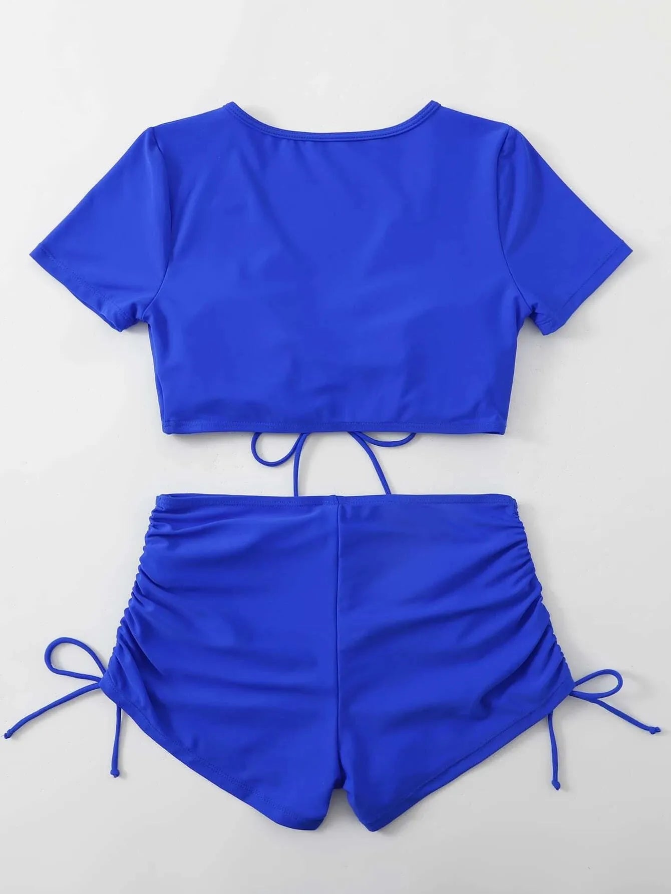 Women's lace-up swimsuit set with bow detail showing top and shorts in available colours