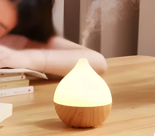 Wood grain finish vase-shaped USB aroma diffuser with 100ml water tank.