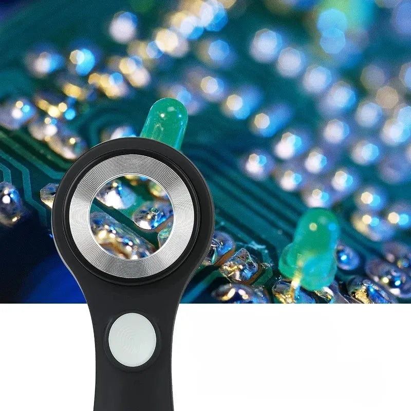 Black handheld magnifying glass with LED light for jewellery and coin appraisal.