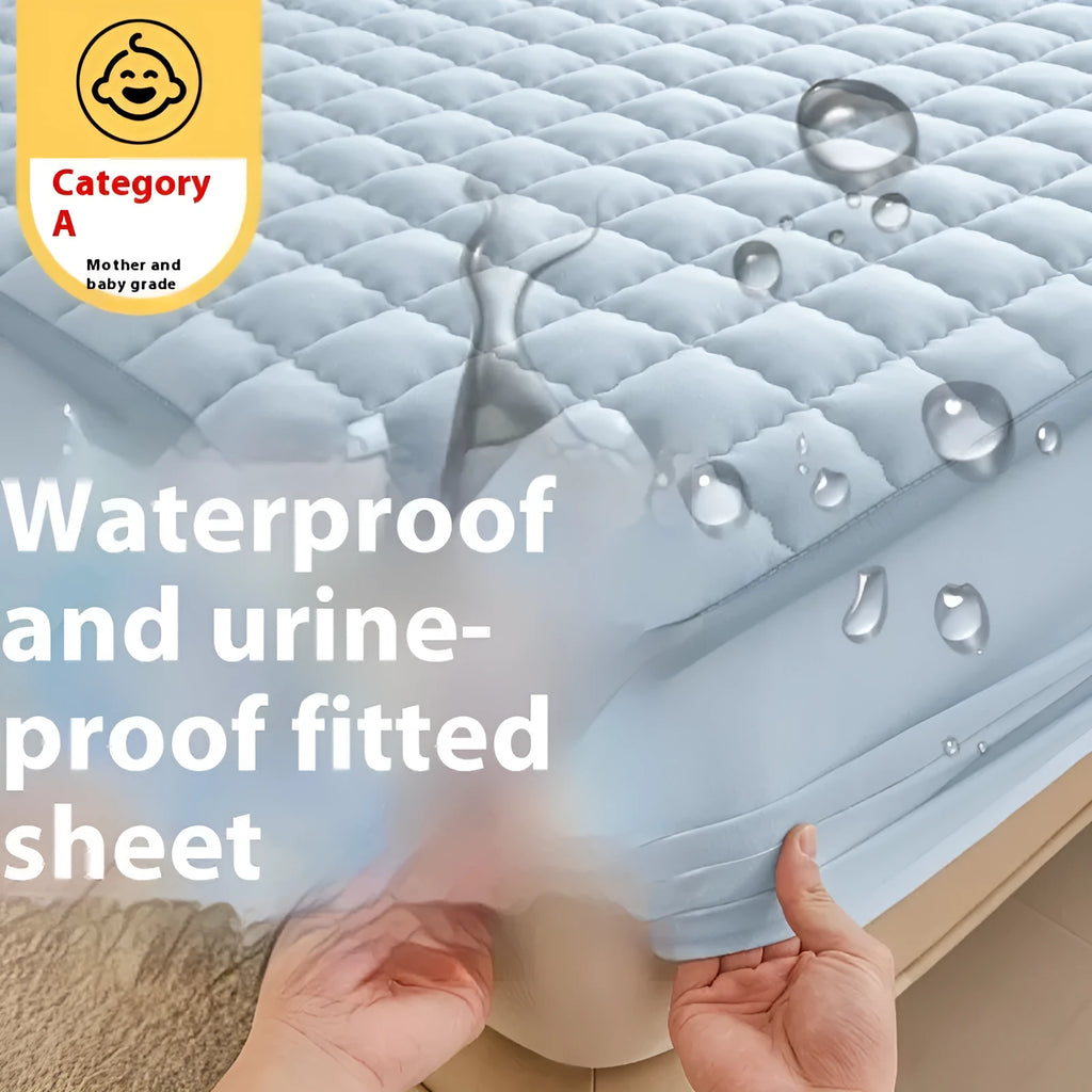 Class A waterproof washed cotton fitted sheet in light grey colour on a bed.