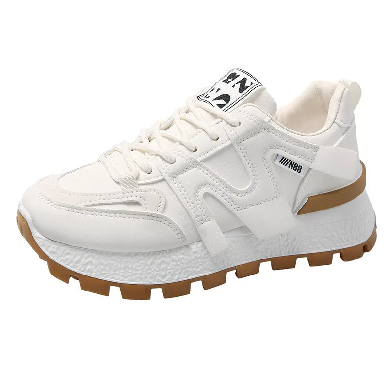 Low-top white running sneakers with round toe and front lace-up design on rubber sole