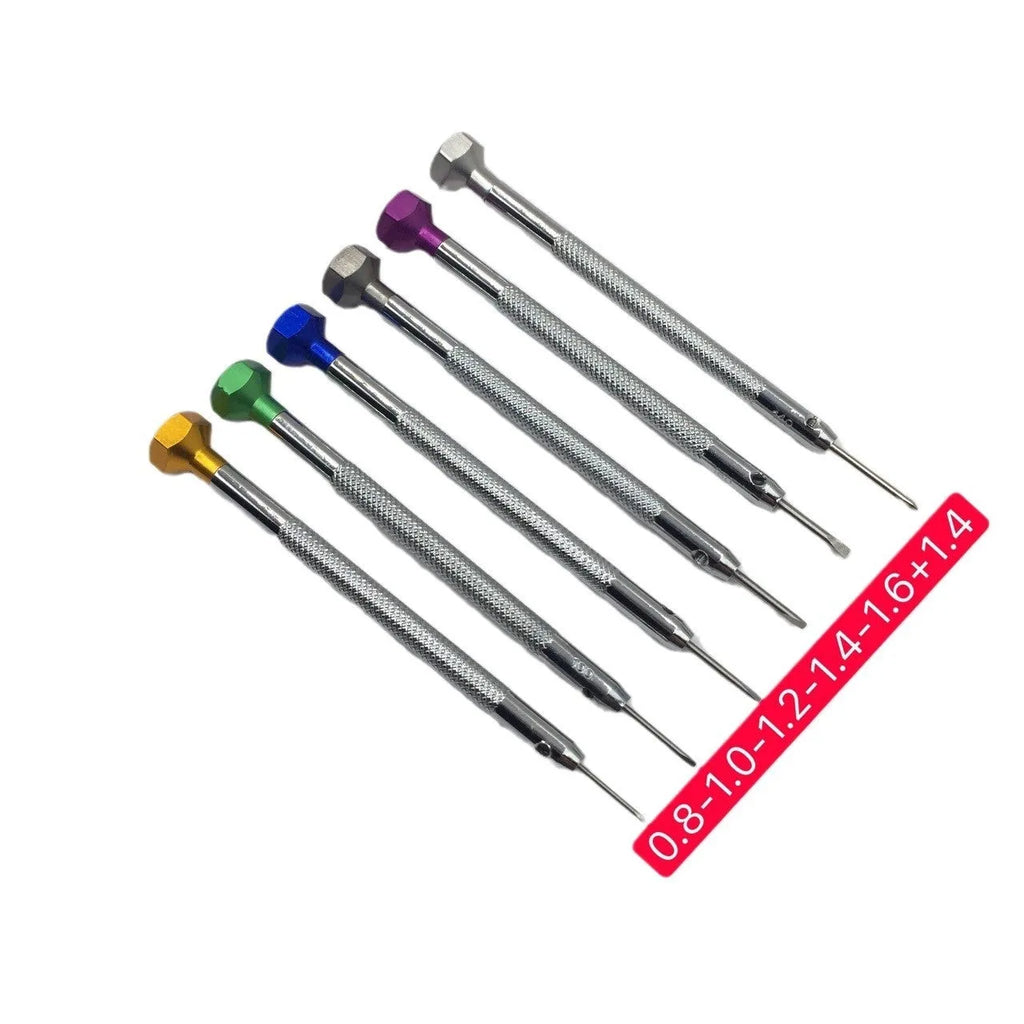 Six colour-coded watch repair screwdrivers with aluminium handles laid out on a surface.