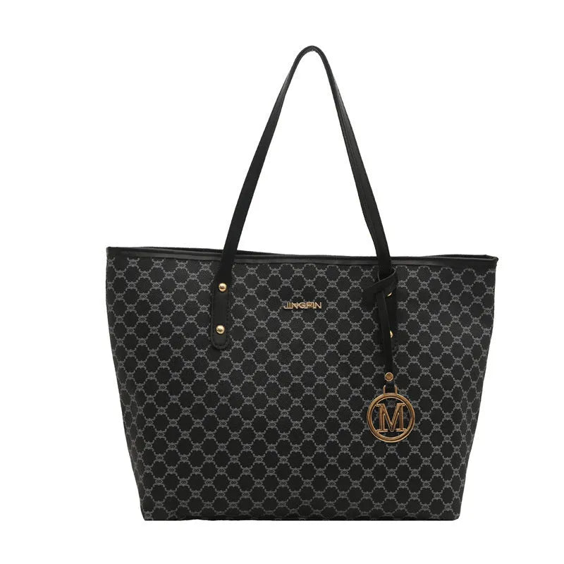 PU leather shoulder bag with sewing thread detail in black colour showing 42cm width and structured design