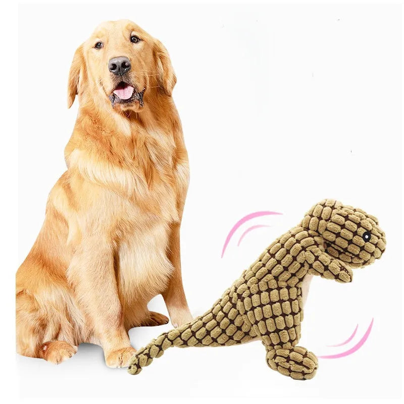 Set of four grey, green, and orange dog toys with sound features for chewing and training