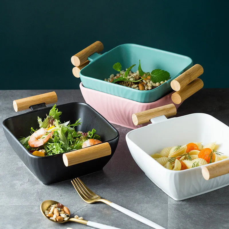 Modern ceramic bowl with irregular organic shape and coordinating lid in porcelain