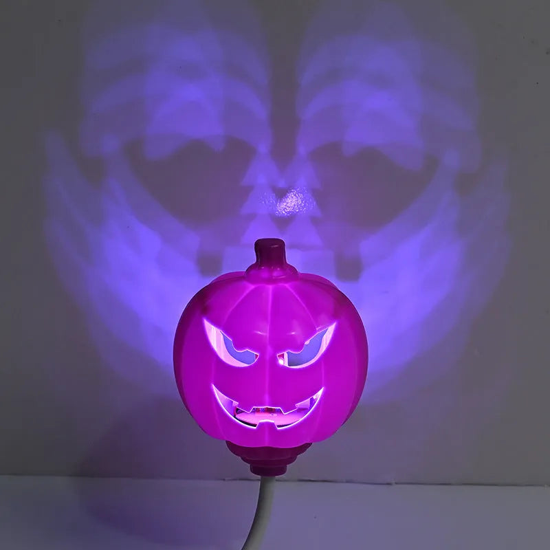 Plastic pumpkin lamp with USB charging cable in purple or yellow light colour