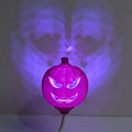 Plastic pumpkin lamp with USB charging cable in purple or yellow light colour