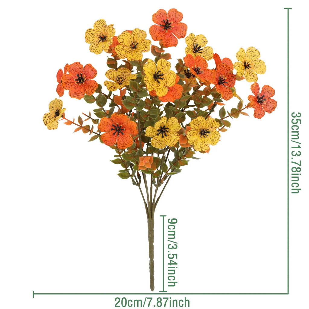 Artificial flower bouquet in autumn orange, red, and yellow colours for home and event decoration.