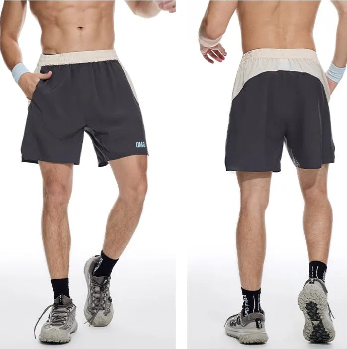 Men's loose grey workout shorts with elastic waist and lace-up fly detail for gym training.