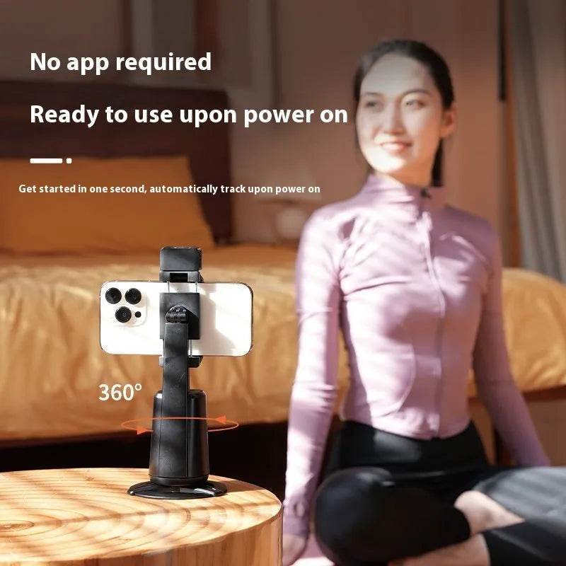 Black desktop phone bracket with ribbon lights and remote control for face tracking adjustment