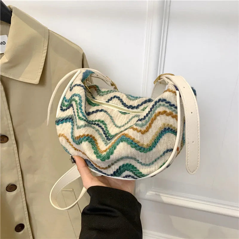 Women's knitted straw woven crossbody bag with single strap in corrugated black or khaki holding phone and files