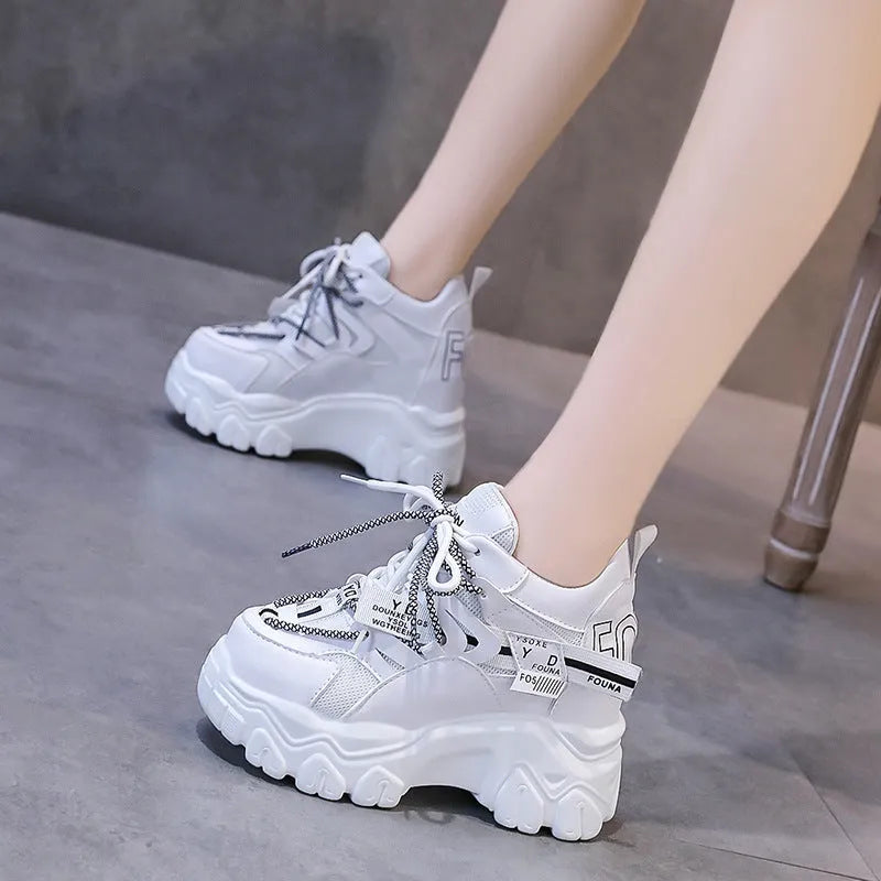 Women's white breathable mesh platform sports shoes with a cross strap and rubber sole.