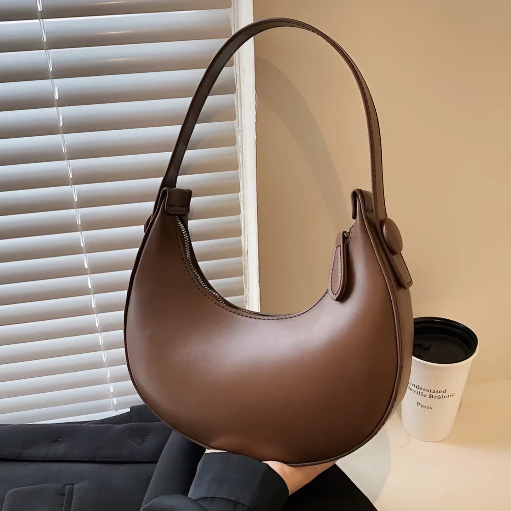 Women's PU dumpling shape shoulder bag in retro brown with zipper compartment, measuring 21x20x6cm