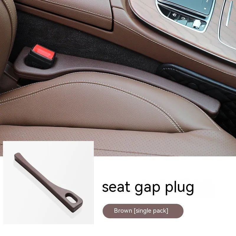 Polyurethane car seat gap filler strip in black, shown next to a vehicle centre console.