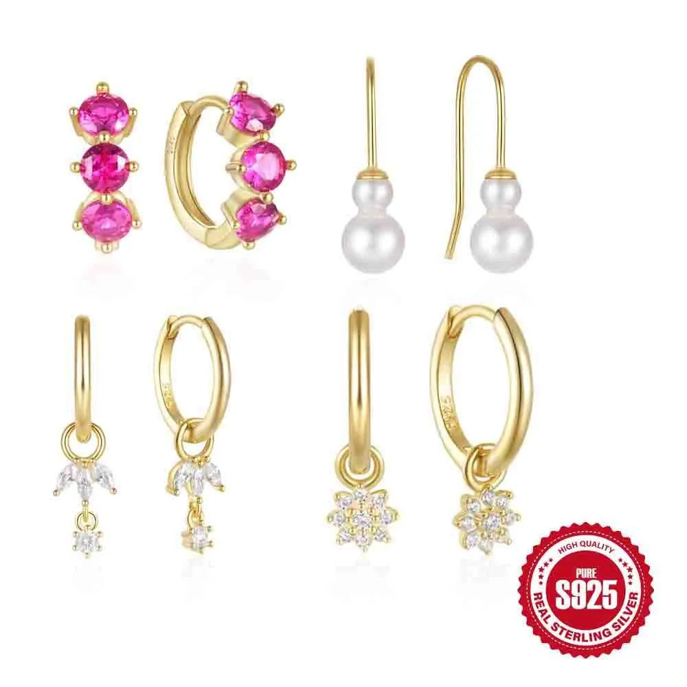 Golden coloured geometric sunflower sterling silver earrings with zircon inlay on a white background.