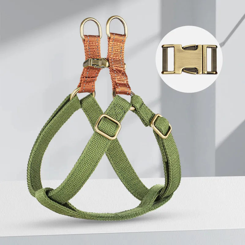 Brown vest style dog leash with alloy fastener shown on small dog