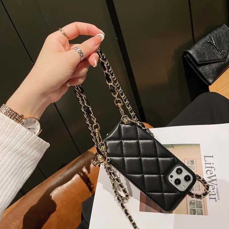 Xiaoxiangfeng imitation leather iPhone case with adjustable cross-body strap and small golden ball detail.