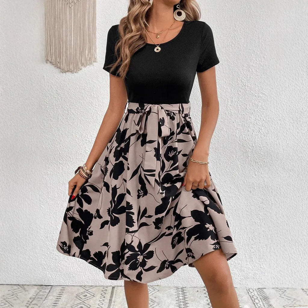 Women's khaki casual dress with A-line skirt, lace-up front detail, and regular sleeves on a mannequin.
