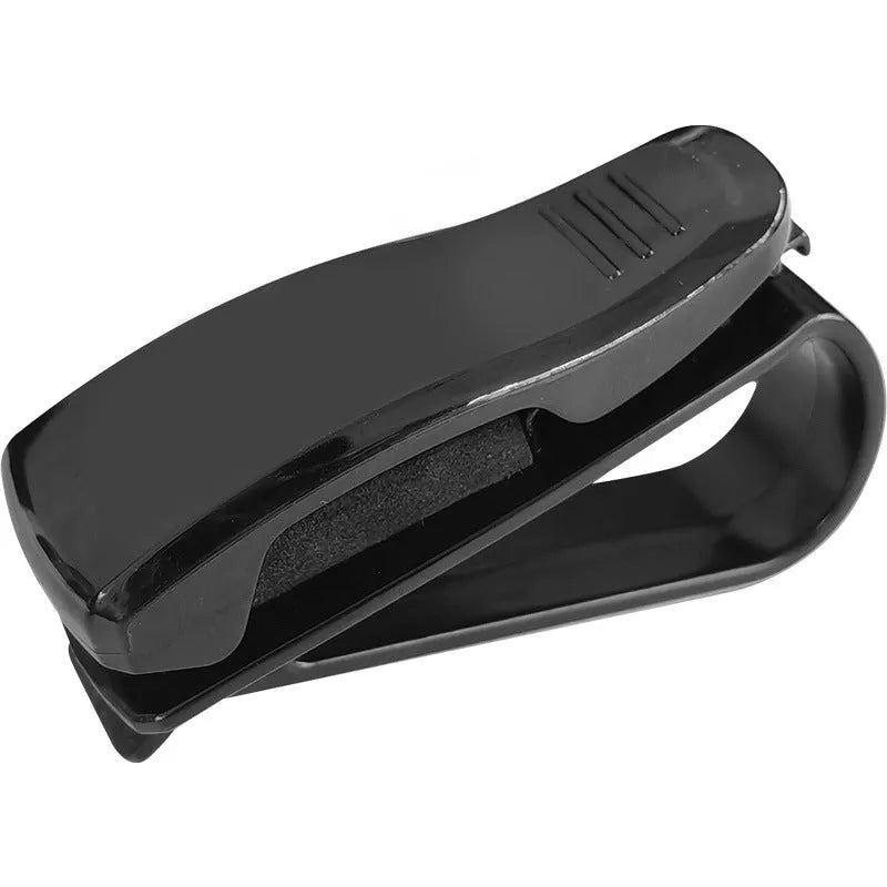 Black plastic multifunctional clip for car sunshade holding sunglasses and cards.