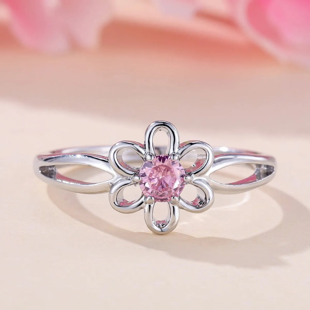 Close-up of a ladies floral hollow ring in electroplated copper with a platinum pink diamond finish.