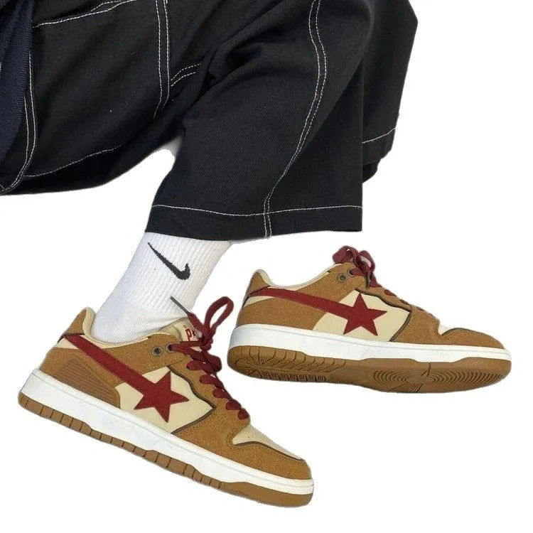 Brown women's low-top platform sneakers with sequin trim and round toe, shown from the side.