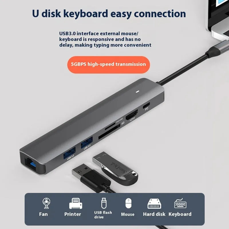 Silver LQT-LH07 7-in-1 USB-C hub and card reader for laptops showing multiple ports.
