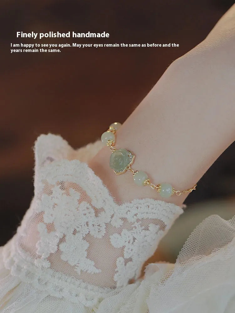 Women's bracelet with Hetian jade rose petals and 14K gold gilding in a floral design.
