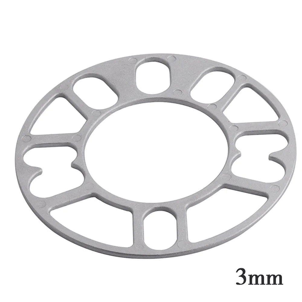 Automotive wheel hub widening spacer ET gasket in various thicknesses for brake caliper clearance.