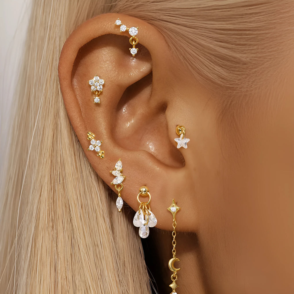 S925 sterling silver geometric moon earring with an embedded diamond star design in a gold colour finish.