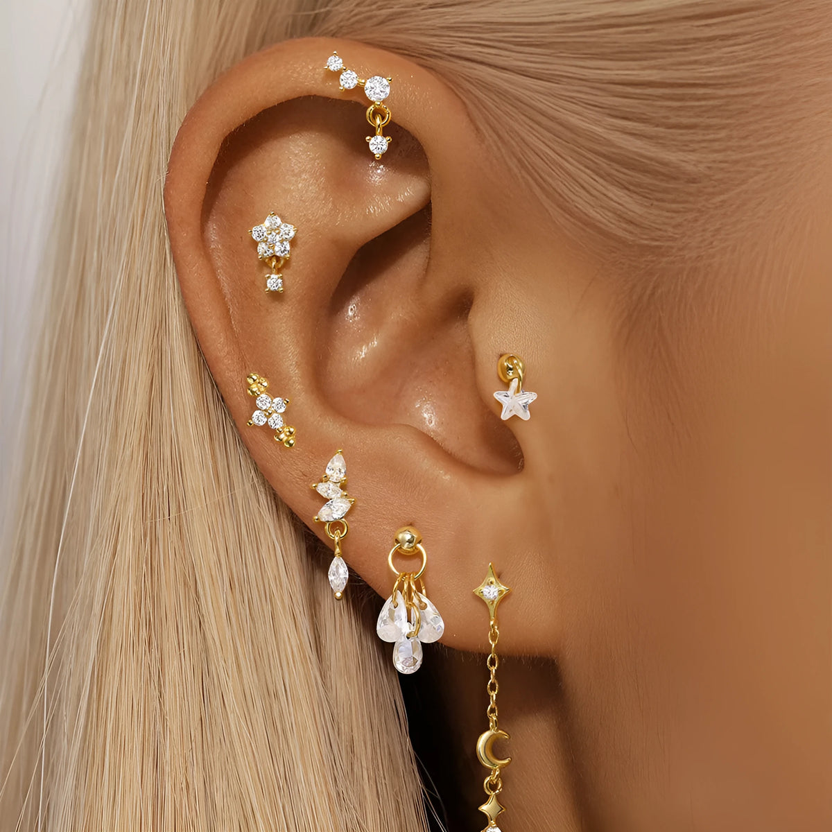 S925 sterling silver geometric moon earring with an embedded diamond star design in a gold colour finish.