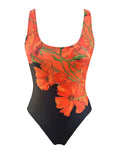 Orange floral print backless one-piece swimsuit on a model, showing slim fit design.
