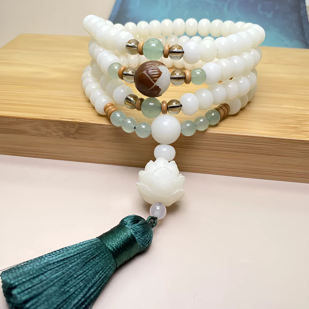 White jade bodhi bead bracelet with 108 beads in a mala style, shown in three different pattern options.