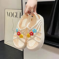 PVC round-toe sandals with non-slip soles and floral decoration in beige and black colour options