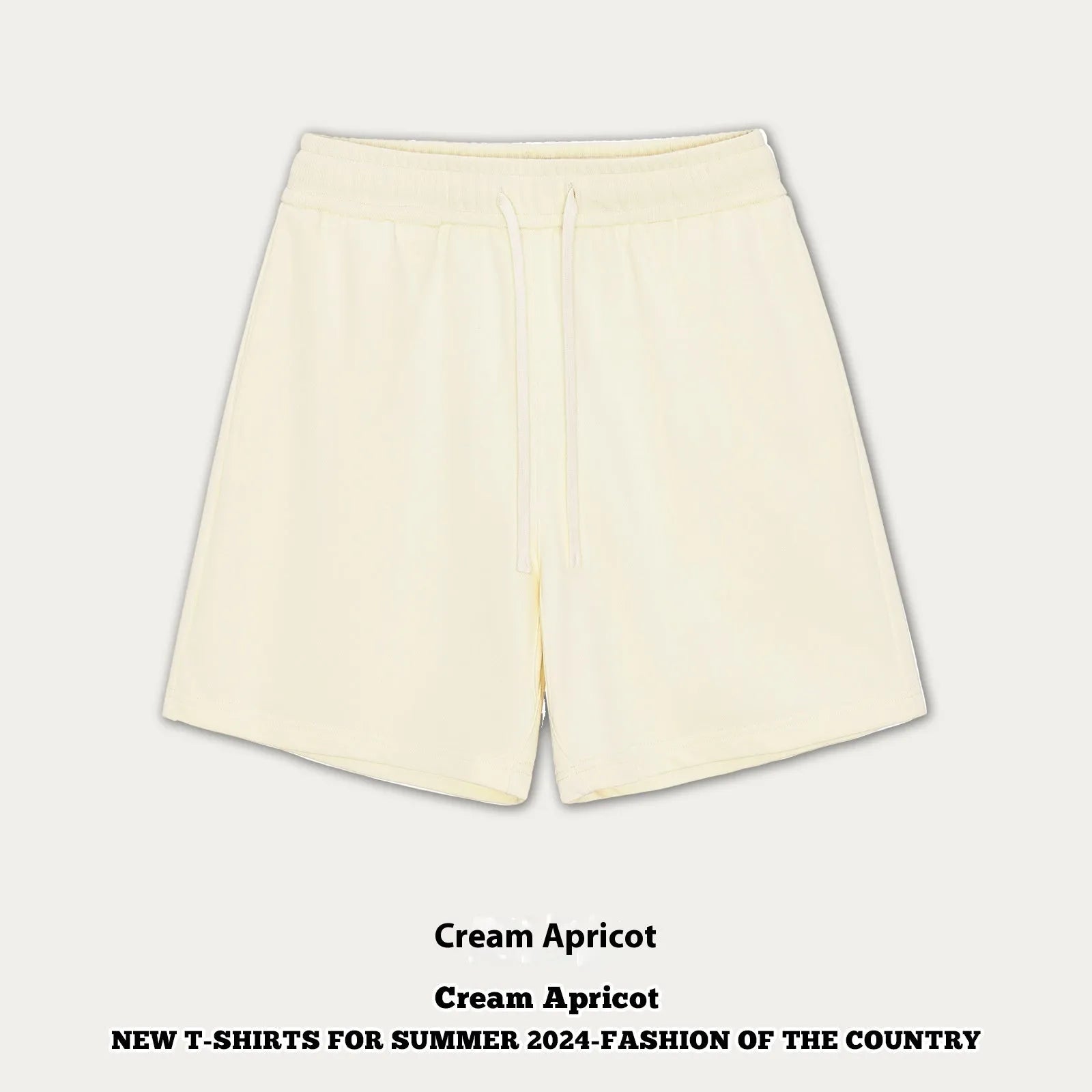 Baby boy and girl wearing loose-fit cotton denim shorts in charcoal grey and cream apricot colours.