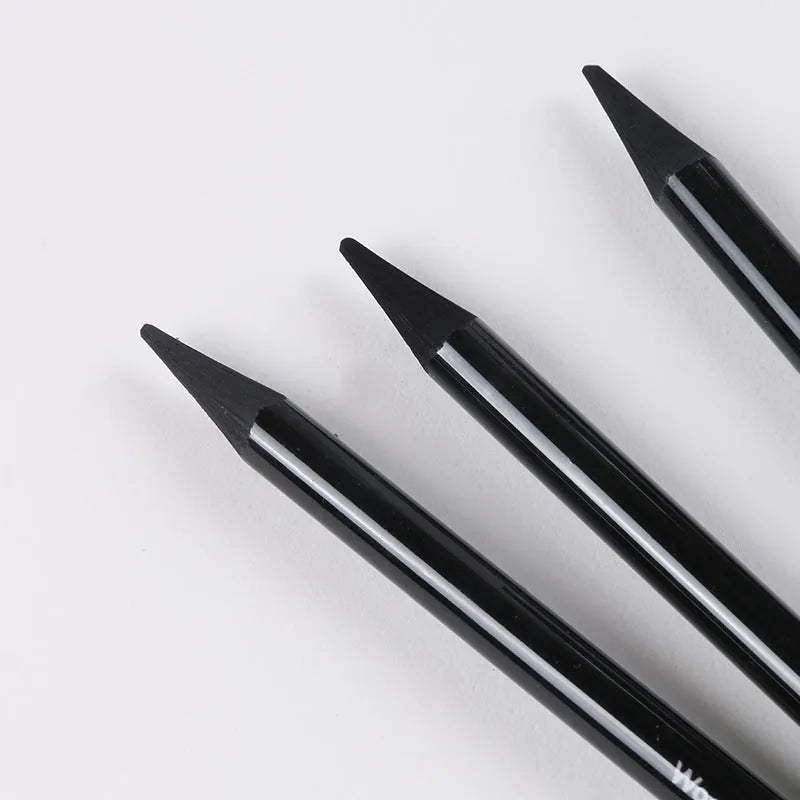 Carbonised pencil suit showing six graphite and three carbonised wooden pencils on suction card packaging