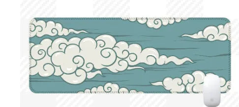 Large rectangular cloud pattern mouse pad and desk mat in natural rubber on a wooden desk.
