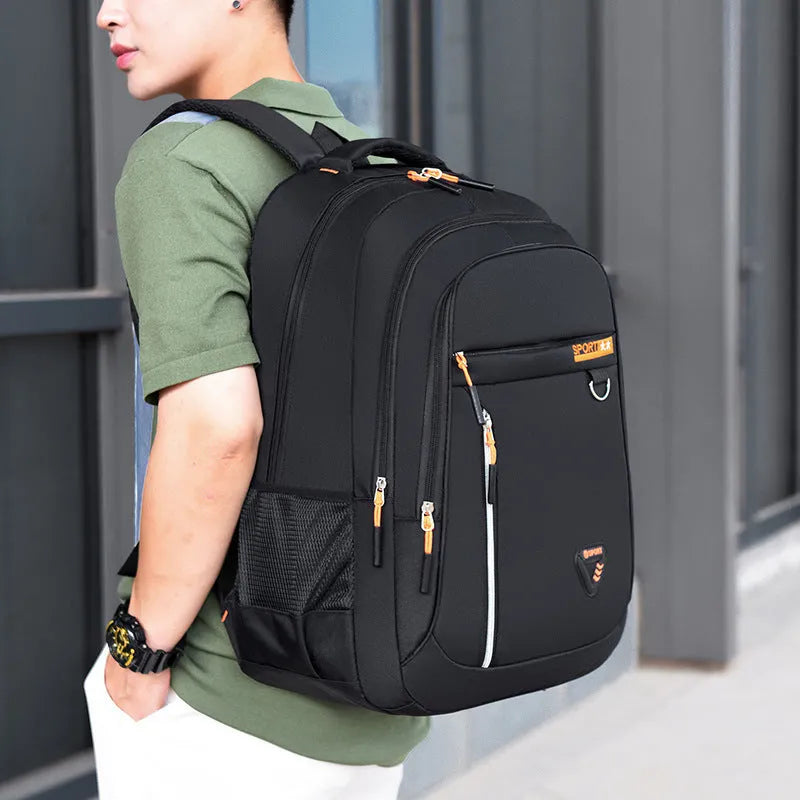 Men's Oxford cloth schoolbag in black with letter pattern, showing large capacity and air pillow straps