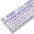 Set of purple to white gradient keycaps with a sublimation printed rabbit design for mechanical keyboards.