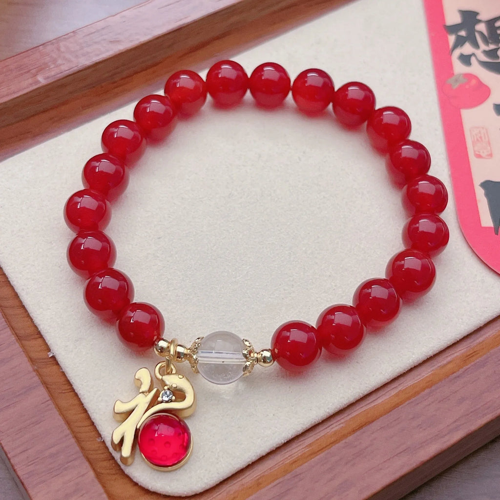 Handmade red agate bracelet with dragon motif for women, Chinese style.